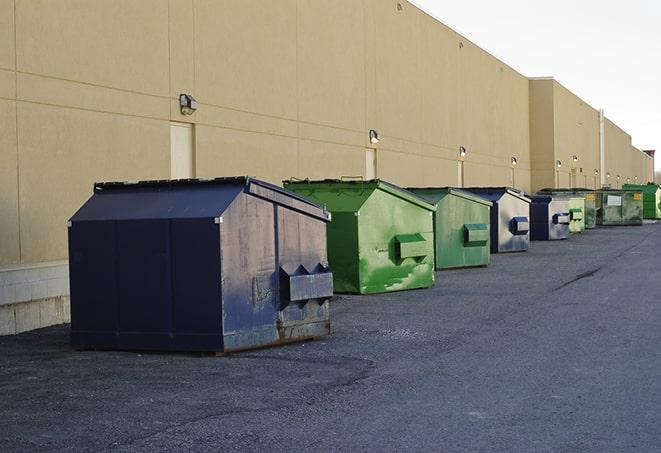 construction waste bins waiting to be picked up by a waste management company in Alexander